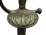 a close up of a sword with a decorative handle