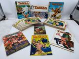 a bunch of comics are sitting on a white table
