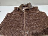 a brown fur vest with a bow on the collar