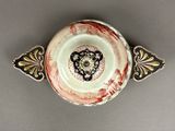 a small bowl with a decorative design on it
