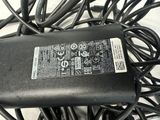 a black charger that is connected to a black cord