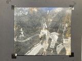 a picture of a black and white picture hanging on a wall