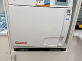 a machine that is sitting in the corner of a kitchen