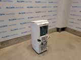 a small air conditioner sitting in the middle of a room