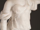 a statue of a woman with a hat on her head