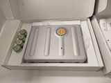 a white box with a cooler inside of it