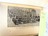 a picture of a book with a picture of a factory on it