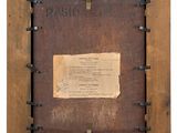 an old wooden frame with a piece of paper in it