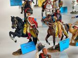 many figurines of soldiers on display in a display case