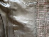 a close up of a jacket with a tie on it