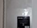 the back side of a clear plastic binder with a sticker on it