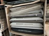 a lot of laptops stacked on top of each other in a box