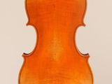 an old violin with a wooden back and bow on a white background
