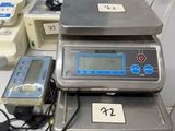 three electronic scales sitting on top of a table