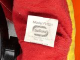 a close up of a watch on a red cloth