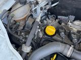 a car engine that is sitting in the trunk of a car