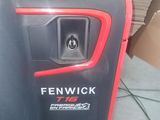 a red and black machine that is sitting on the floor