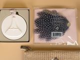 a purse and a wallet sitting on a table next to other items