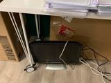 a desk with a computer and a lot of files on it