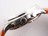 an image of a close up of a watch on a white surface