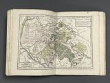 an old book with a map of the city of london on it