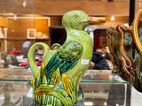 many vases that are on display in a glass case