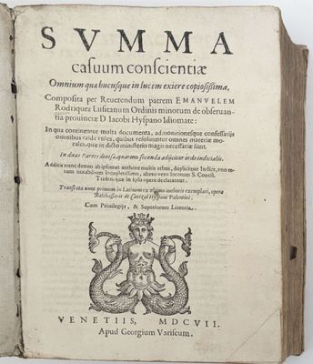 an old book with a picture of a dragon on it