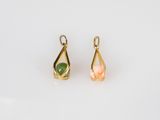 a pair of gold earrings with green and pink stones