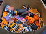 a cardboard box filled with assorted items for halloween