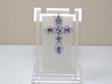clear acrylic cross with blue and white stones on display