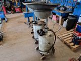 an image of a machine in a garage with a lot of work on it