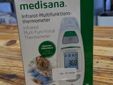 a box on a table with a thermometer on it