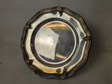 a silver plate that is sitting on a table