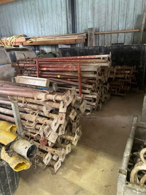 a large pile of pipes and pipes in a warehouse