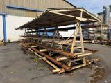 a wooden structure that is sitting in the middle of a parking lot