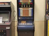 three arcade machines in a row next to each other