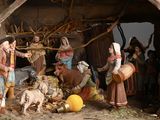 many figurines of people in a nativity setting