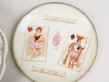 a plate with pictures of people on it next to a bowl