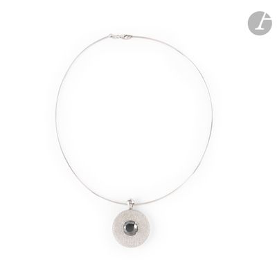 silver plated necklace with a round pendant on a white background