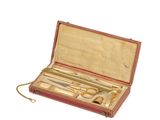 a red case with scissors and a pair of scissors in it