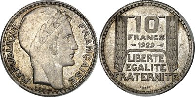 a silver coin with an image of a woman ' s head on it