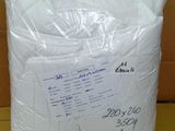 a close up of a bag of white toilet paper on a table