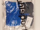 a plastic bag with a pair of blue gloves in it