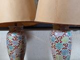 two lamps that are sitting on a table in a room