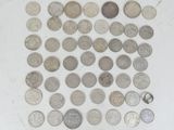 a lot of coins that are on the table