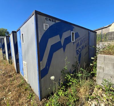 a blue and white sign on the side of a building