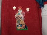 a red sweater with a picture of a santa claus on it