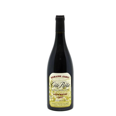 a bottle of wine sitting on top of a white table