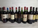 several bottles of wine are lined up on a table