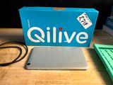 a box of olive products sitting on a table next to a laptop